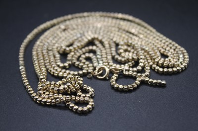 Lot 414 - A 9ct gold double string guard chain (one...