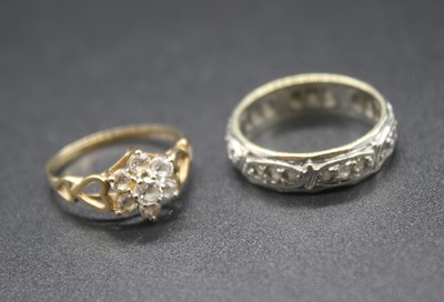 Lot 439 - A 9ct gold and cz flower head cluster ring,...