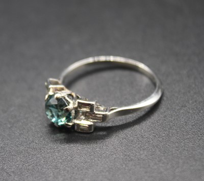 Lot 442 - A platinum, blue zircon and baguette cut...