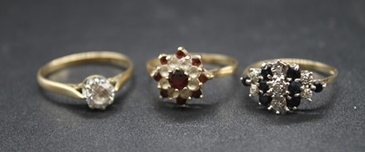 Lot 446 - A 9ct gold, garnet and cz set flower head...