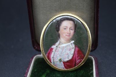 Lot 471 - A French painted enamel portrait miniature of...