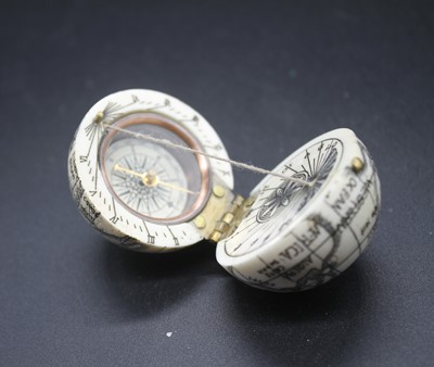 Lot 480 - A reproduction faux ivory pocket compass in...