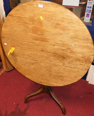 Lot 1170 - A 19th century oak and fruitwood circular tilt-...