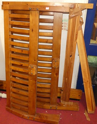 Lot 1175 - A contemporary stained pine slatted double...