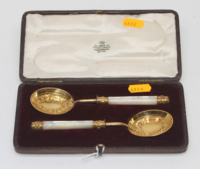 Lot 366 - A pair of presentation spoons each having a...