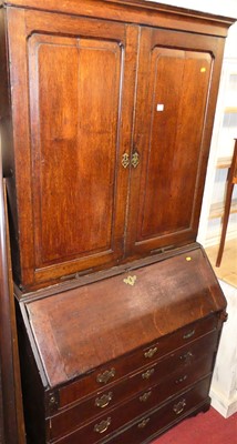 Lot 1185 - An early 19th century provincial oak bureau...