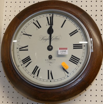 Lot 1195 - An oak cased circular wall clock, the white...