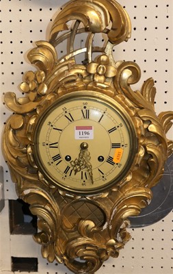 Lot 1196 - A Swedish carved giltwood cartel clock, h.60cm