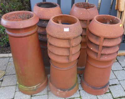 Lot 1214 - A set of four terracotta vented chimney tops,...