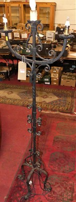 Lot 1233 - A wrought iron three branch floor light, h.155cm