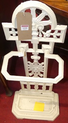 Lot 1259 - A Victorian cream painted cast iron stickstand,...