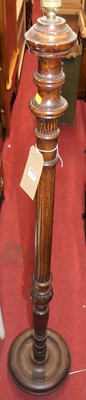 Lot 1306 - A turned and fluted mahogany standard lamp,...