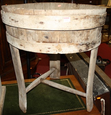 Lot 1312 - A rustic planked pine circular washstand,...