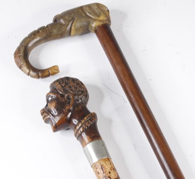 Lot 4188 - A 19th century walking cane, the fruitwood...