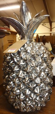 Lot 1323 - A composite silvered model pineapple, h.50cm