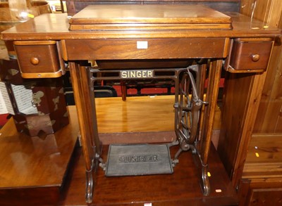 Lot 1341 - A Singer treadle sewing machine table