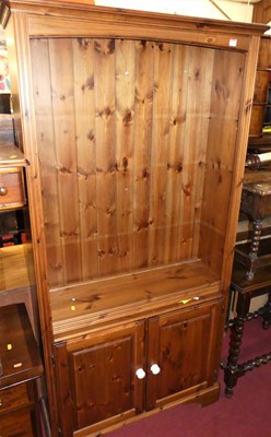 Lot 1343 - A modern pine freestanding open bookshelf,...