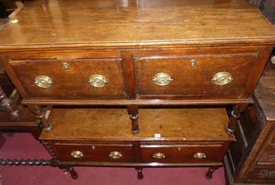 Lot 1348 - An unusual pair of made-up oak low two drawer...