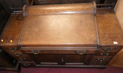 Lot 1353 - A Victorian walnut Dickens-type desk, having...