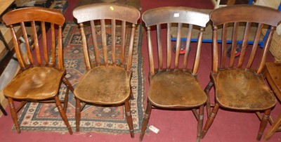 Lot 1366 - A set of four early 20th century elm seat and...