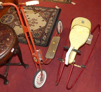 Lot 1370 - A painted pressed metal child's rocking horse;...