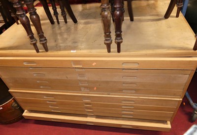 Lot 1388 - A large beech ten drawer two section plan...