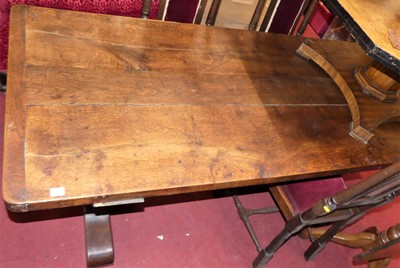 Lot 1394 - A 19th century plank topped round cornered oak...