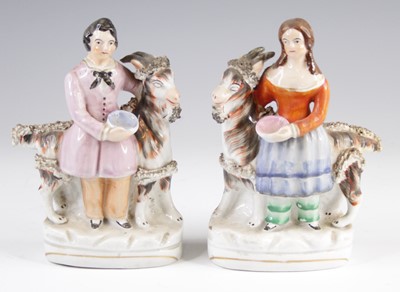 Lot 4063 - A pair of Victorian Staffordshire figures of...
