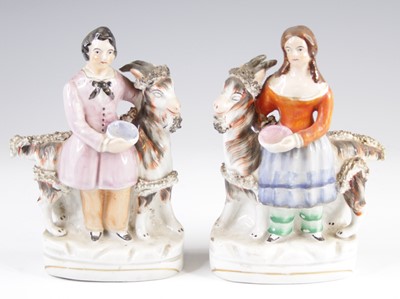 Lot 4063 - A pair of Victorian Staffordshire figures of...