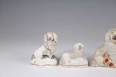 Lot 4055 - A Victorian Staffordshire model of a spaniel,...