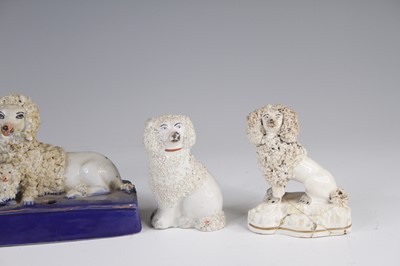 Lot 4055 - A Victorian Staffordshire model of a spaniel,...
