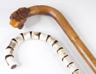 Lot 4197 - An early 20th century bamboo walking cane, the...