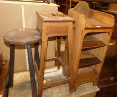 Lot 1451 - A rustic pine narrow low open shelf; together...