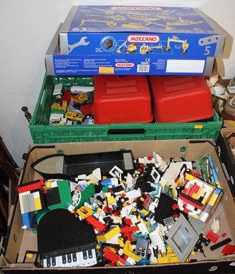 Lot 773 - Two boxes of toys to include vintage lego,...