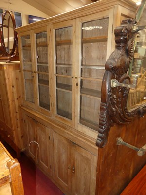 Lot 1462 - A Victorian pine bookcase cupboard, having...