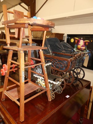 Lot 1477 - Three small dolls prams; together with a dolls...