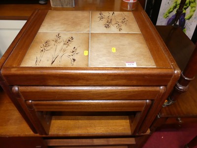 Lot 1478 - A 1970s teak and tile inset nest of three...