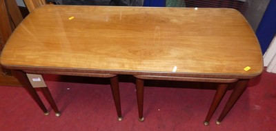 Lot 1479 - A 1970s teak, laminate and glass inset nest of...