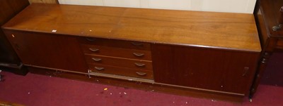 Lot 1483 - A 1970s teak low sideboard, having four...