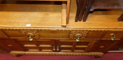 Lot 1486 - A 1930s light oak ledgeback sideboard, with...