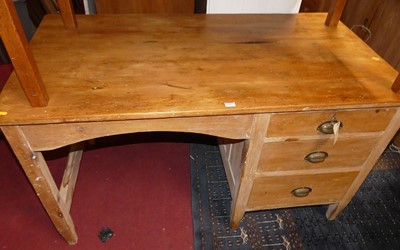 Lot 1493 - A rustic pine kneehole desk, having three...