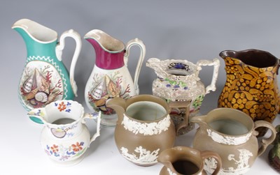 Lot 4071 - A collection of nine Victorian pottery jugs,...