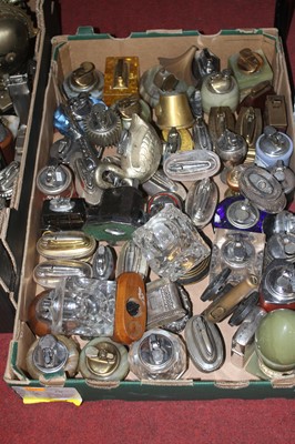 Lot 720 - A box of table lighters to include novelty...