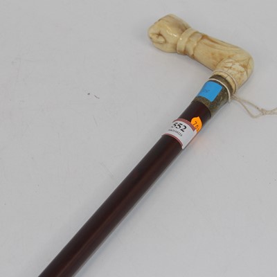 Lot 552 - A walking stick having a bone handle in the...