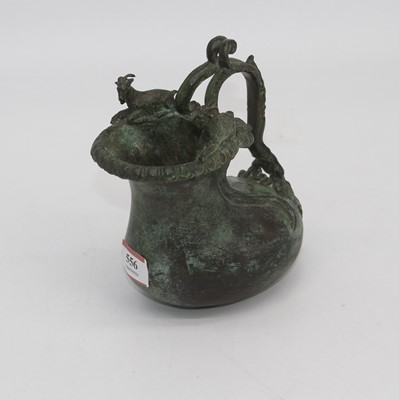 Lot 556 - An eastern verdigris bronze ewer, having a...