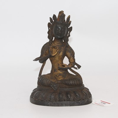 Lot 558 - An eastern gilt metal figure of a deity, h.19cm