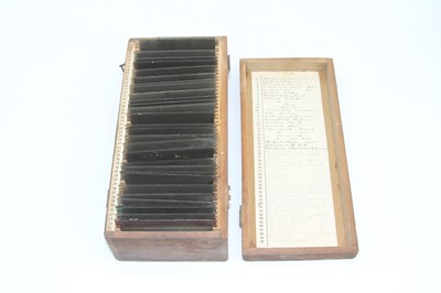 Lot 562 - A collection of magic lantern slides, cased