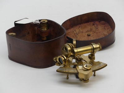 Lot 569 - A reproduction brass miniature sextant, in a...