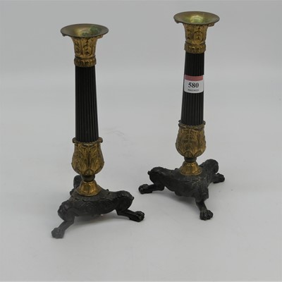 Lot 580 - A pair of reproduction parcel-gilt bronze...