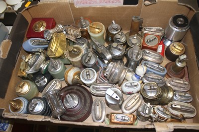 Lot 802 - A box of table lighters to include novelty...